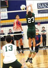  ?? Photos by Ernest A. Brown ?? LEFT, the celebratio­n is on for the Mount St. Charles boys' volleyball team after defeating Bishop Hendricken in four games on Saturday night. RIGHT, MSC senior Dan Gould (2) records a kill.