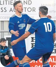  ??  ?? Cove’s Mitch Megginson (left) celebrates after scoring the opening goal