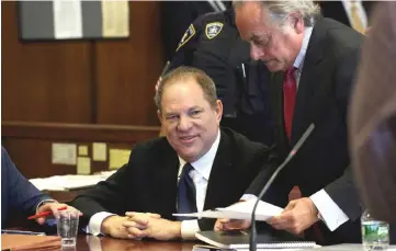  ?? — Reuters file photo ?? Weinstein speaks to his lawyer Benjamin Brafman inside Manhattan Criminal Court during an arraignmen­t in the Manhattan borough of New York, last July 9.