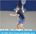  ?? ?? LOS CABOS, Mexico: Russia’s Daniil Medvedev returns the ball against Serbia’s Miomir Kecmanovic during their Mexico ATP Open 250 men’s singles tennis match on August 5, 2022. —AFP