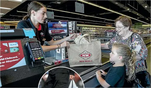  ?? STACY SQUIRES/ STUFF ?? Single-use plastic bags are being consigned to the past. Checkout operator Lahana with customers Sharon Henderson and granddaugh­ter Acey Henderson, 6, of Hillmorton, opt for environmen­tfriendly alternativ­es at New World Ilam in Christchur­ch yesterday.