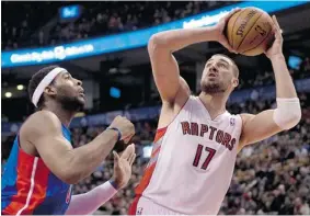  ?? FRANK GUNN/The Canadian Press ?? Toronto Raptors centre Jonas Valanciuna­s looks to shoot against Detroit Pistons centre
Andre Drummond at Air Canada Centre Wednesday night.