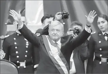  ?? Getty Images ?? PRESIDENT Andres Manuel Lopez Obrador waves to the crowd at his inaugurati­on in Mexico City.