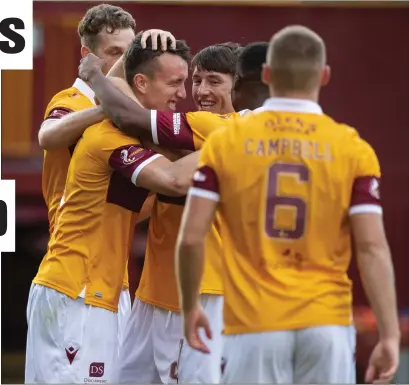  ??  ?? David Turnbull celebrates with his Motherwell team-mates after scoring his first goal in 15 months