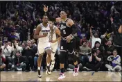  ?? MARK J. TERRILL — THE ASSOCIATED PRESS ?? Los Angeles Clippers guard Russell Westbrook, right, celebrates after scoring as Sacramento Kings forward Harrison Barnes runs behind during the second half on Friday, in Los Angeles.