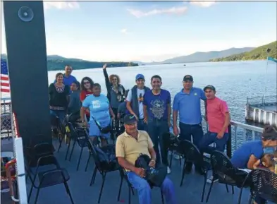  ?? PHOTO PROVIDED ?? Backstretc­h workers were thrilled at the scenery during a ride aboard the Minne-Ha-Ha on Lake George.