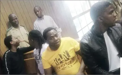  ?? (Pic: Nhlanganis­o Mkhonta) ?? The four men accused of bombing the Standard Bank ATM and taking money at the Mbabane Industrial Site, during their court appearance yesterday.