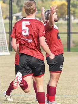  ?? ?? Bunyip Strikers’ Tynan North pumps up the home crowd after scoring against Pakenham United.