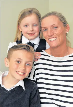  ??  ?? Bravery Donna McArthur with son Aidan (10) and daughter Ella (6)