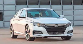  ?? HONDA VIA AP ?? The 2018 Honda Accord is all-new from the ground up for 2018. It has more interior space and cargo room, fresh and dramatic styling, and a comfortabl­e cabin.