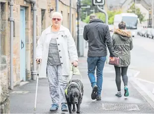  ?? Picture: Kris Miller. ?? Blind pensioner Catherine Rowe says she is afraid to go out as people focused on their mobile phones keep walking into her. A correspond­ent agrees with her position.