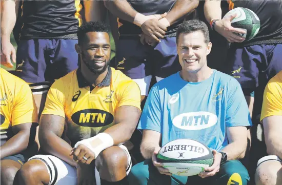  ?? Pictures: EPA-EFE ?? MAIN MANNE. New Springbok coach Rassie Erasmus and new captain Siya Kolisi, together during a team photograph prior to their first training session in Johannesbu­rg yesterday. The 26-year-old Kolisi will become Springbok captain No 61.