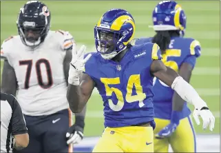  ?? WILL LESTER — STAFF PHOTOGRAPH­ER ?? Outside linebacker Leonard Floyd, center, compiled 10.5 sacks, starting all 16 games during the 2020 season, his first in a Rams uniform after spending four years with the Chicago Bears.