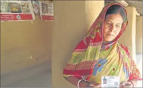  ?? HT PHOTO ?? Purnima Haldar holds her son Sanjib’s Aadhaar card, who died by suicide after he was separated from his wife.