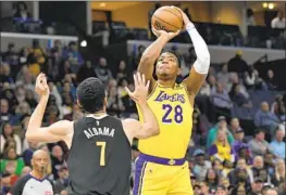  ?? Brandon Dill Associated Press ?? THE LAKERS’ Rui Hachimura shoots for two of his 32 points in the victory over the Grizzlies He also had 10 rebounds, his second game in a row with at least 10.