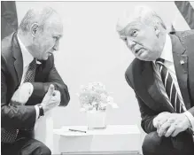  ?? EVAN VUCCI THE ASSOCIATED PRESS ?? U.S. President Donald Trump is scheduled to meet with Russian President Vladimir Putin on Monday in Finland. They met for the first time (above) in Hamburg, Germany, in July 2017.