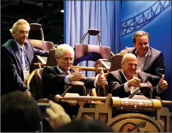  ?? Courtesy Photos ?? Christian von Elverfeldt, left, CEO of Mack Rides, joins Silver Dollar City’s President Brad Thomas, right, for the long-awaited reveal of the Time Traveler vehicle. Based in Germany and founded in 1780, Mack Rides has been family-owned for eight...