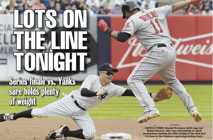  ?? AP PHOTO ?? CATCH A THIEF: Ronald Torreyes (left) tags out Rafael Devers, who was attempting to steal second base during the fifth inning of the Red Sox’ 5-1 loss to the Yankees yesterday in New York.