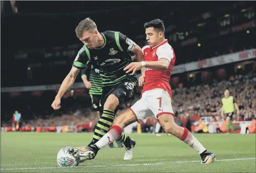  ?? PICTURE: JOHN WALTON/PA WIRE ?? BLOCKED: Centre-half Joe Wright denies Arsenal’s Alexis Sanchez during Doncaster Rovers’ narrow recent defeat in the Carabao Cup at Emirates Stadium.