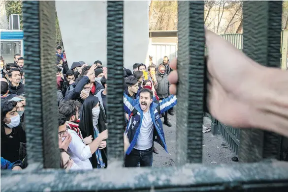  ??  ?? Iranian students attend an anti-government protest inside Tehran University on Saturday. Recent demonstrat­ions in the country have been fuelled by anger over a still-faltering economy, unemployme­nt and rampant corruption. — THE ASSOCIATED PRESS FILES