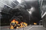  ?? MICHEL EULER / AP ?? Cars burn after a march on Thursday in Nanterre, outside Paris. The killing of a 17-year-old during a traffic check Tuesday, captured on video, shocked the country and stirred up long-simmering tensions between young people and police in housing projects.