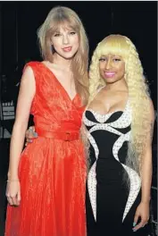  ?? Larry Busacca
Getty Images ?? THEY WEREN’T HOSTILE here, in 2011, and Nicki Minaj, right, says she and Taylor Swift can laugh now.