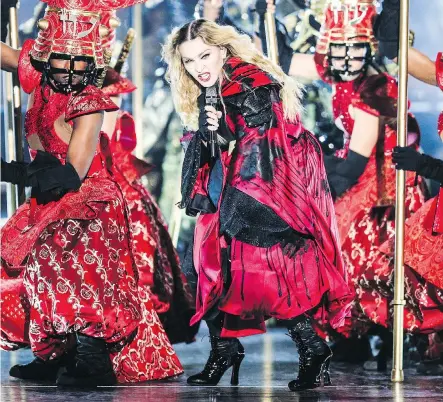  ?? RICH FURY/THE ASSOCIATED PRESS ?? Madonna, seen on stage in 2015 during her Rebel Heart Tour, made ambitious costume changes, revolution­ary lighting and complicate­d dance routines her signature. The legendary pop star celebrates her 60th birthday this month.