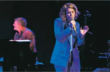  ?? Danny Clinch ?? BRANDI CARLILE honors Joni Mitchell with a performanc­e Monday of her album “Blue” at Disney Hall.