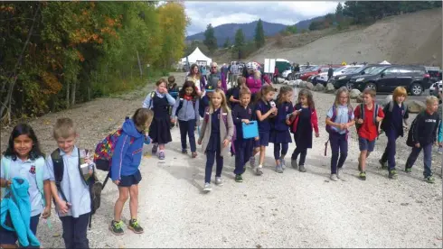  ?? J.P. SQUIRE/Special to The Okanagan Weekend ?? The Grade 3 class from Oyama Traditiona­l School had a brief walk on the Okanagan Rail Trail after an official opening ceremony on Thursday. The class has walked on the trail, but had its first bike ride there on Friday. Teacher Pippa Dean-Veerman plans to take her students there every second Friday after they receive bike safety lessons.