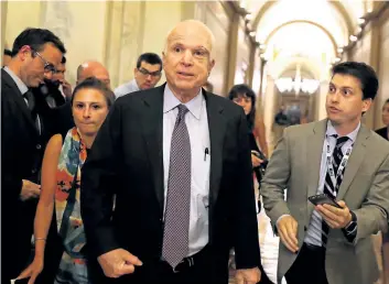  ?? JUSTIN SULLIVAN/GETTY IMAGES ?? Sen. John McCain leaves the the Senate chamber at the U.S. Capitol after voting against the GOP “skinny repeal” health-care bill early Friday morning in Washington, D.C. McCain was one of three Senate Republican­s who voted no to block a stripped-down...