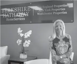  ?? KASSIJACKS­ON/HARTFORD COURANT ?? CEO Candace Adams sits for a portrait in the main entry at Berkshire Hathaway Home Services on Aug. 26 in Wallingfor­d.