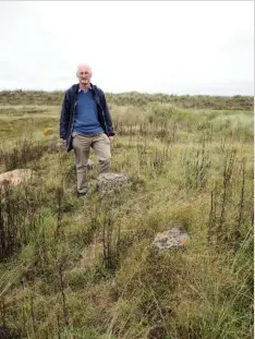  ??  ?? Left: Harold Mytum by some of the stilts or piers which once would have supported a barrack hut