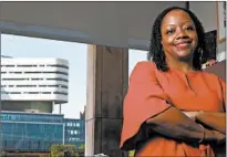  ?? ANTONIO PEREZ/CHICAGO TRIBUNE ?? Darlene Hightower, vice president of Community Health Equity at Rush, stands outside her Chicago office.