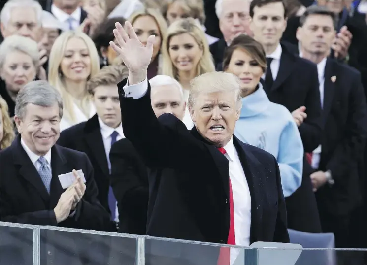  ?? PATRICK SEMANSKY / THE ASSOCIATED PRESS ?? Donald Trump waves following his inaugural address after being sworn in as the 45th president of the United States on Friday.