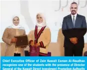  ??  ?? Chief Executive Officer of Zain Kuwait Eaman Al-Roudhan recognizes one of the students with the presence of Director General of the Kuwait Direct Investment Promotion Authority (KDIPA) Sheikh Dr Meshal Jaber Al-Ahmad Al-Sabah.