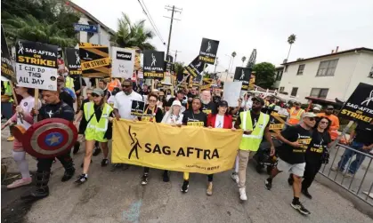  ?? ?? A bid for regulation­s … a Sag-Aftra solidarity march in LA. Photograph: David Livingston/Getty Images