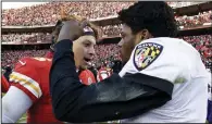  ?? (AP file photo) ?? Kansas City Chiefs quarterbac­k Patrick Mahomes (left) and Baltimore Ravens quarterbac­k Lamar Jackson greet each other after a game Dec. 9, 2018, in Kansas City, Mo. Mahomes and Jackson will face each other in the playoffs for the first time today, pitting two of the most talented players in the NFL.
