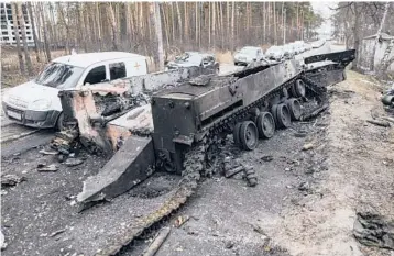  ?? ?? A destroyed Russian tank is seen on March 9 in Irpin, Ukraine, near the capital city of Kyiv.