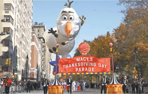 ?? ROBERT DEUTSCH/ USA TODAY ?? Olaf, the snowman in the movie “Frozen,” leads a Macy’s Thanksgivi­ng Day Parade on Thursday that was flanked by heavy security.