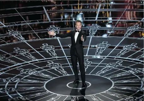  ?? KEVIN WINTER/Getty Images ?? Host Neil Patrick Harris performs at the Academy Awards Sunday. Turn to Page B2 for photos from the red carpet.