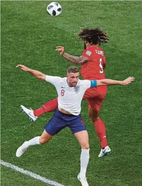  ?? EPA PIC ?? England’s Jordan Henderson (front) and Panama’s Roman Torres vie for the ball in their Group G tie on Sunday.