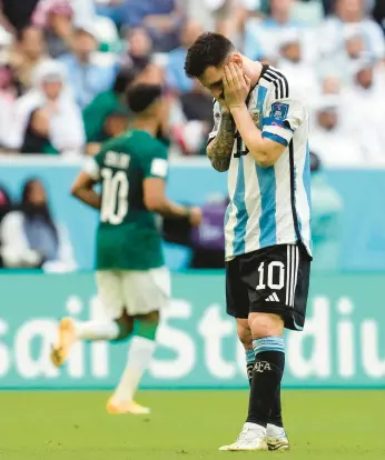  ?? WORLD CUP SAUDI ARABIA 2, ARGENTINA 1 NATACHA PISARENKO/AP ?? Lionel Messi and Argentina saw its 36-match unbeaten streak end with a loss to Saudi Arabia on Tuesday.