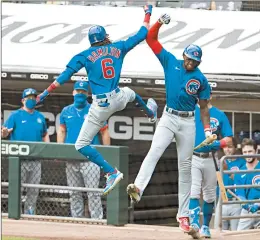  ?? BRIAN CASSELLA/CHICAGO TRIBUNE ?? Chicago Cubs center fielder Billy Hamilton (6) and right fielder Cameron Maybin (15) celebrate Hamilton's home run in the fourth inning on Sunday.