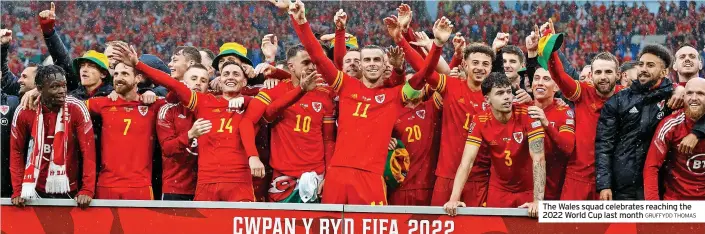  ?? GRUFFYDD THOMAS ?? The Wales squad celebrates reaching the 2022 World Cup last month