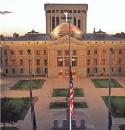  ??  ?? Flags are lowered to half staff at the Arizona Capitol in honor of Sen. John McCain on Sunday. The six-term senator died Saturday. MICHAEL CHOW /THE REPUBLIC