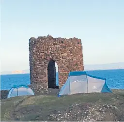  ??  ?? Tents pitched around the 18th Century Lady’s Tower in Elie.