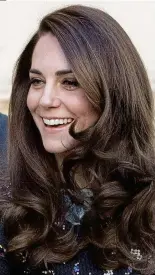  ??  ?? Tale of two brunettes: Meghan (main) and Kate look stunning in red frocks and (above left) the actress’s curls are a perfect match for the Duchess’s long locks