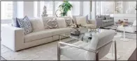  ?? (TNS/Handout) ?? An oversize neutral sofa helps to add an expansive seating area in this narrow living space.