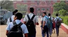  ?? — PTI ?? Students arrive at Gurgaon’s Ryan Internatio­nal School which re-opened on Monday after 10 days closure following the murder of an eight-year-old boy.