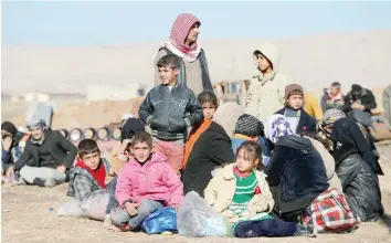  ?? Reuters ?? Iraqi people escaping from the is stronghold town of Bartella, east of Mosul, on Tuesday. —